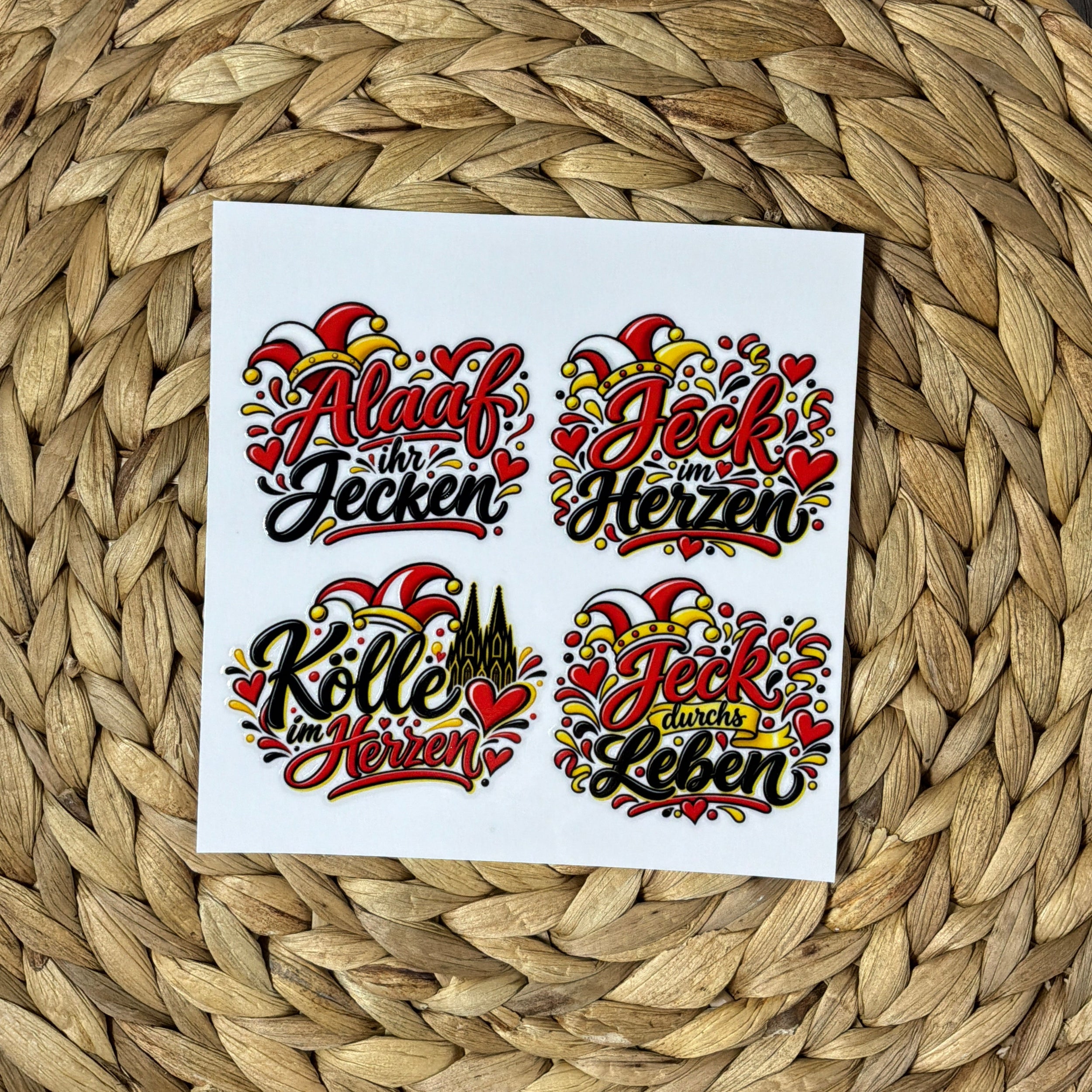 Rub-On-Bogen 15 × 15 cm mit vier kölschen Karnevalsmotiven in Rot, Schwarz und Gelb